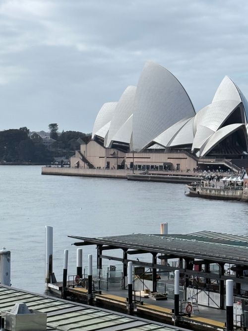 Free A scenic view of Sydney Opera House by the water, showcasing its unique architecture. Stock Photo