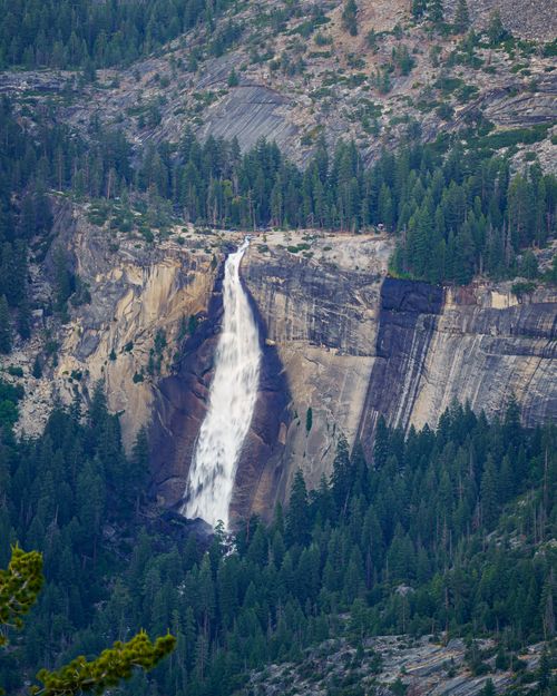 Free A breathtaking view of a waterfall cascading down a cliff in Yosemite National Park. Stock Photo