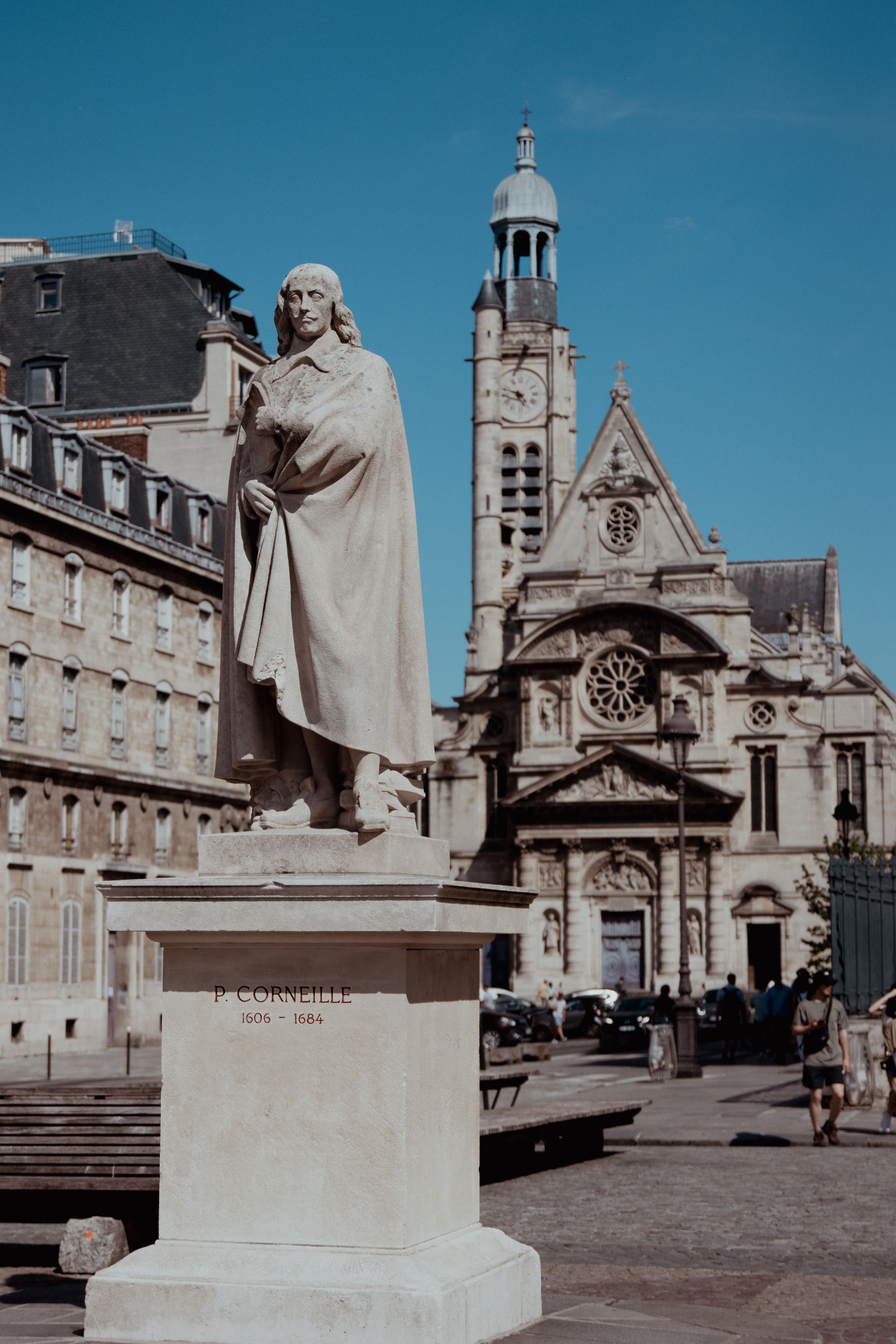 Statue of Pierre Corneille with St-Étienne-du-Mont Church in the background, Paris.