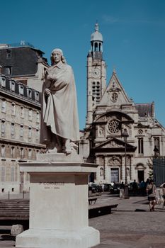 Statue of Pierre Corneille with St-Étienne-du-Mont Church in the background, Paris.