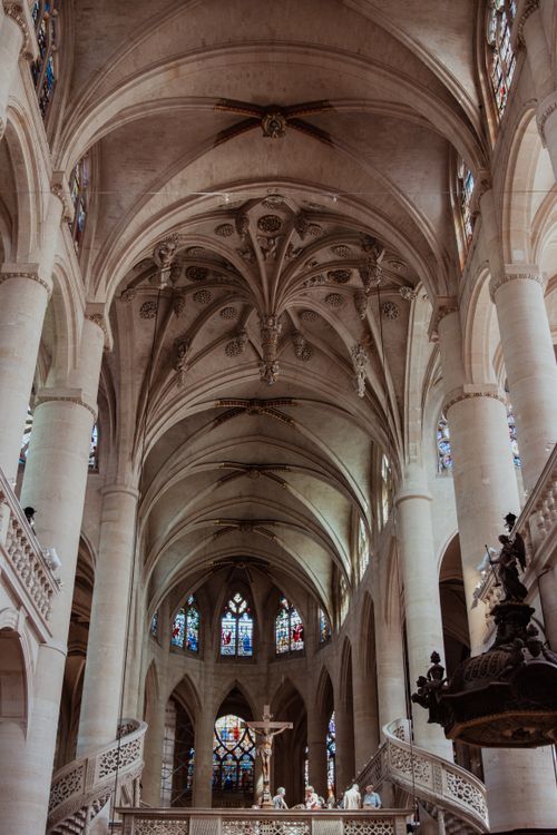 Free Majestic gothic arches and stained glass of Saint-Eustache in Paris. Stock Photo