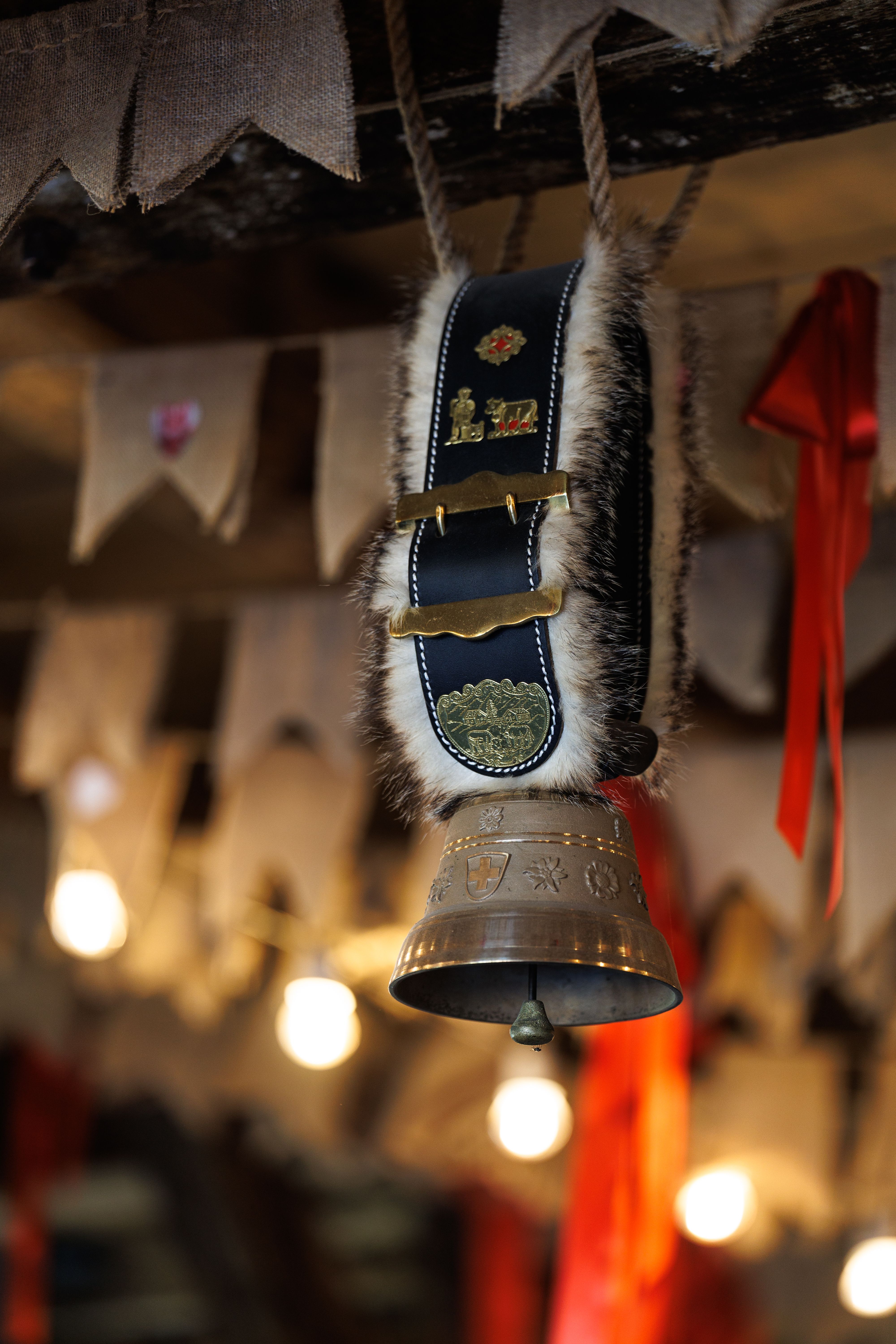Close-up of a decorative bell with ornate details, set in a rustic indoor environment in Kaliningrad.