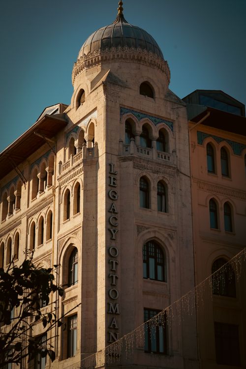 Free Elegant architectural facade of the Legacy Ottoman Hotel in Istanbul, Turkey at sunset. Stock Photo
