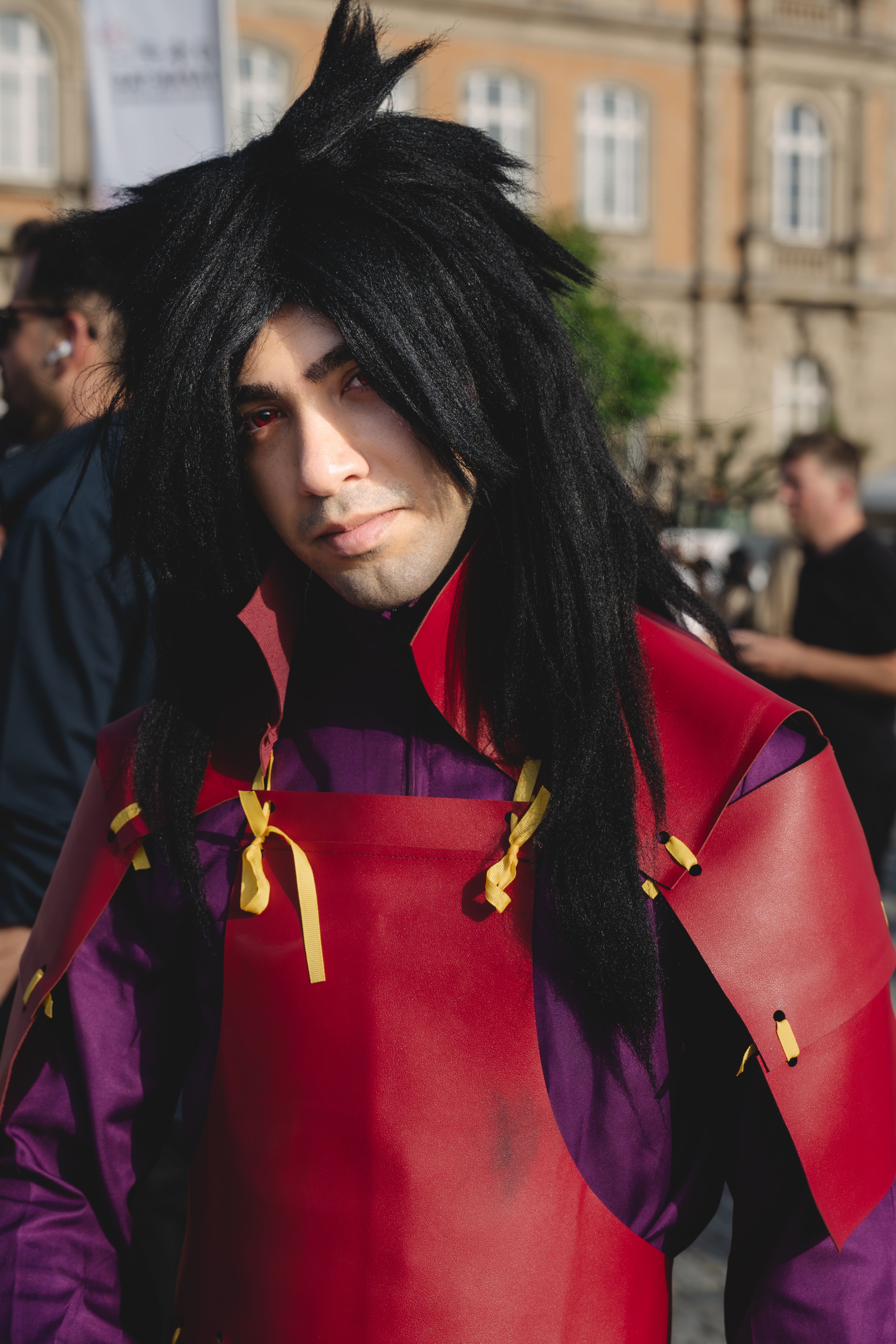 Anime cosplayer in Düsseldorf, Germany, wearing detailed costume outdoors.