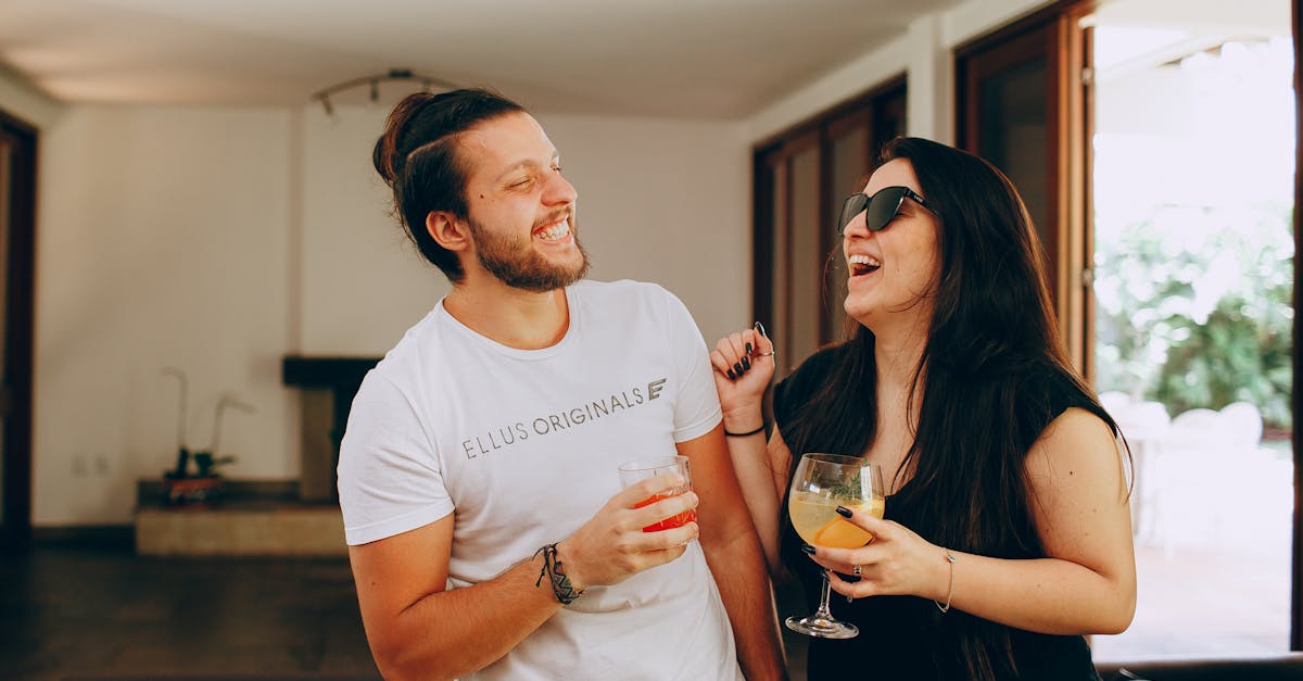 Physical Scene Of Friends Having A Tense Conversation, With One Friend Looking Defensive And The Other Appearing Accusatory