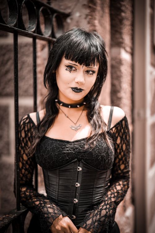 Free A gothic fashion model poses against a stone wall in Bursa, Türkiye. Stock Photo