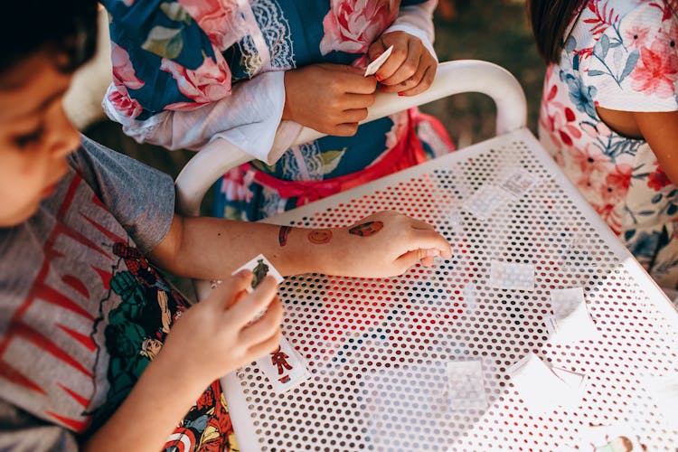 Crop Children With Small Cards Near Table