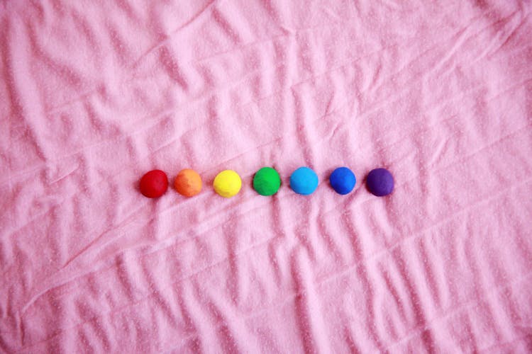 Colorful Balls In Pink Fabric