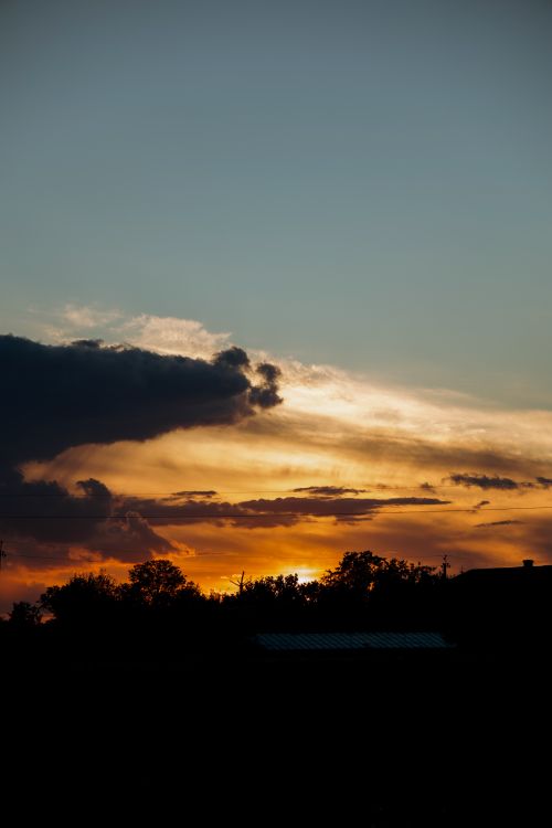 Free Beautiful sunset casting vibrant hues across the skyline in Ivano-Frankivsk, Ukraine. Stock Photo