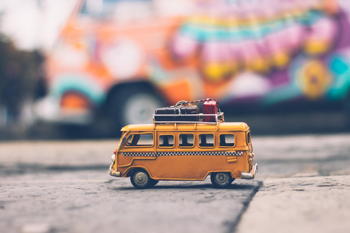 portrait Photography of Yellow School Bus with blur background