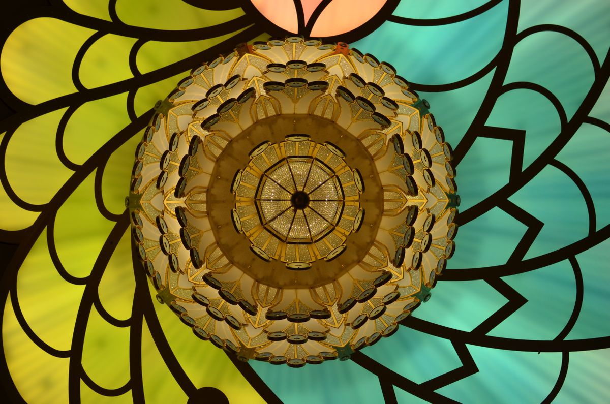Vibrant custom stained-glass panel in a kaleidoscope pattern