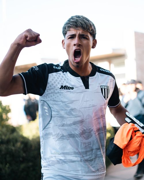 Free A young soccer player cheers passionately during a game, showcasing sports spirit. Stock Photo