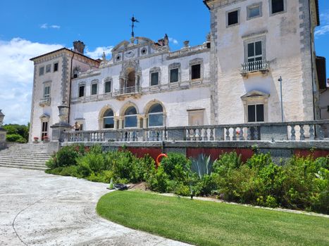 Elegant historic villa with classical architecture in Miami, featuring lush gardens.