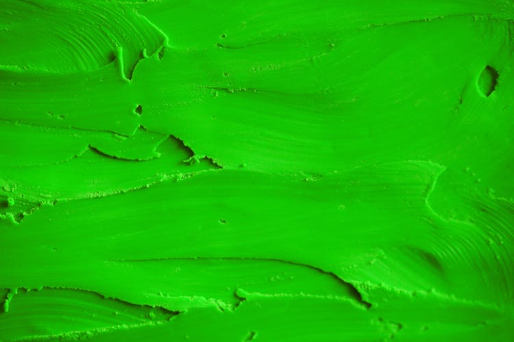 A Close-up Shot Of A Green Frosting