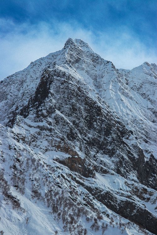 Free Stunning view of a snow-covered mountain peak in Himachal Pradesh, India, under a clear blue sky. Stock Photo