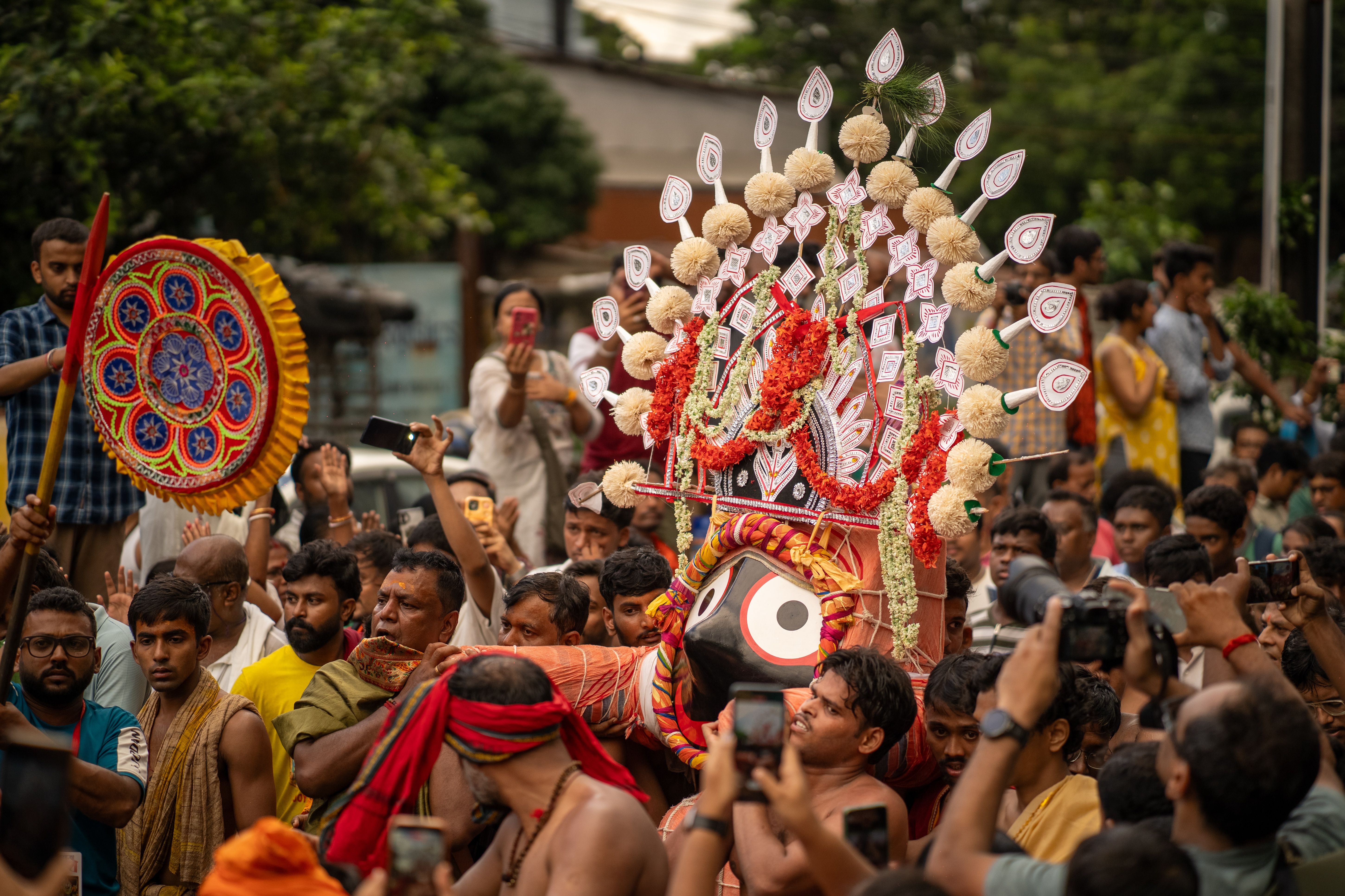 Colorful Rath Yatra procession with crowd in Kolkata, India