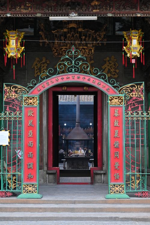 Free Traditional Chinese temple entrance with intricate design in Ho Chi Minh City, Vietnam showing ancient cultural heritage. Stock Photo