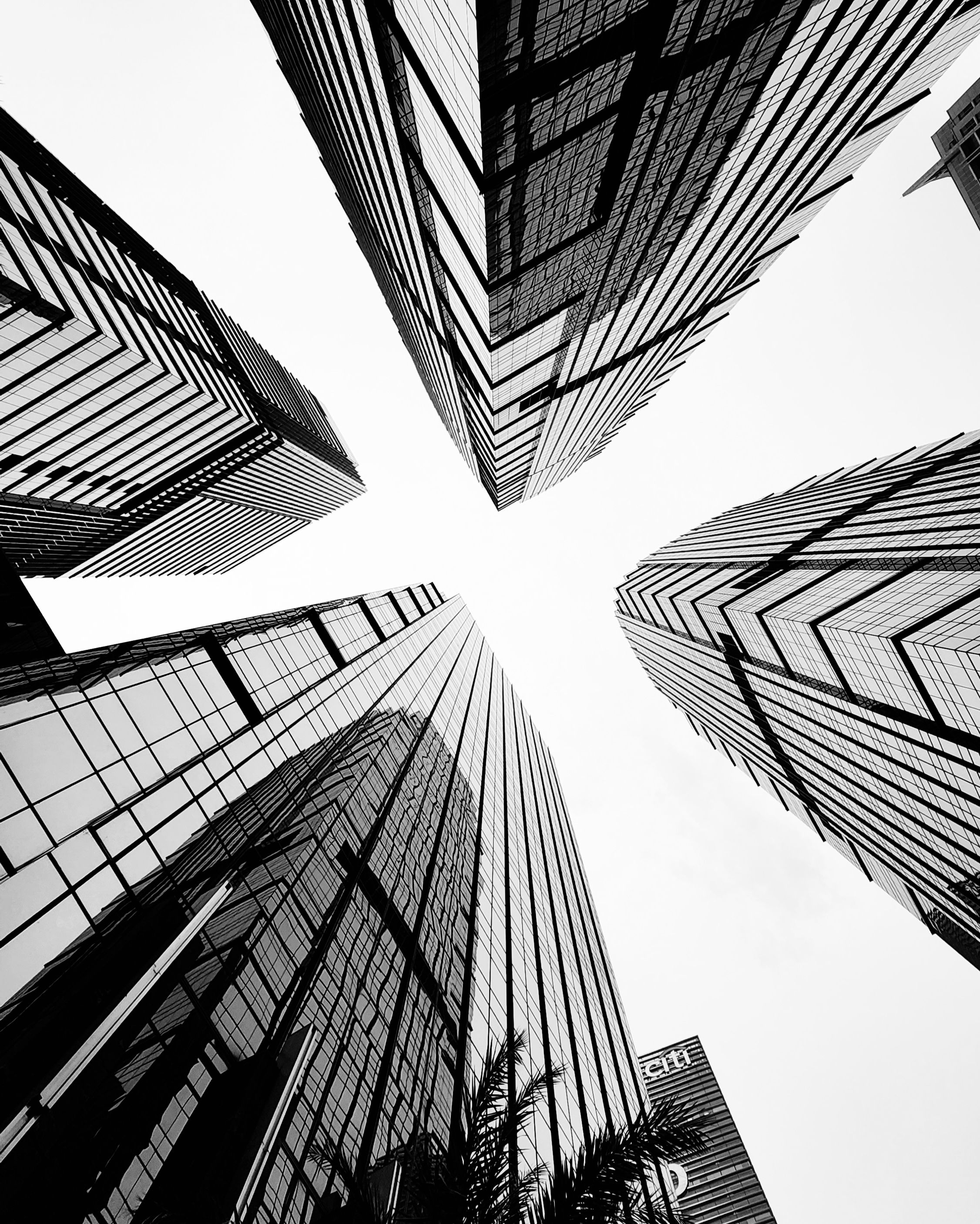 Dynamic upward view of modern skyscrapers in Jakarta creating a dramatic architectural scene.