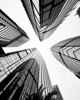 Dynamic upward view of modern skyscrapers in Jakarta creating a dramatic architectural scene.