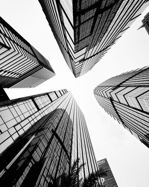 Dynamic upward view of modern skyscrapers in Jakarta creating a dramatic architectural scene.
