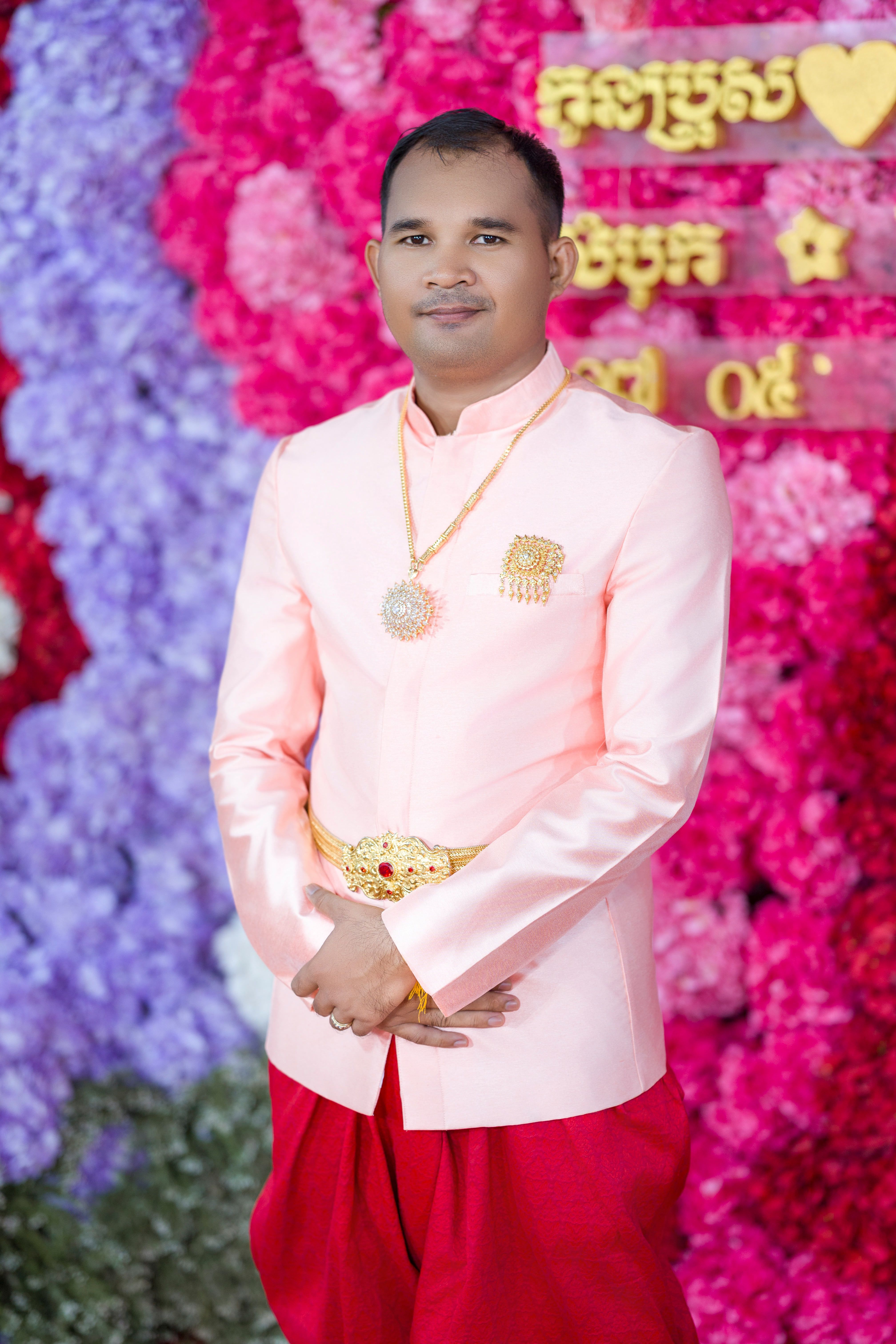 Man in elegant traditional Cambodian wedding attire, showcasing cultural richness.