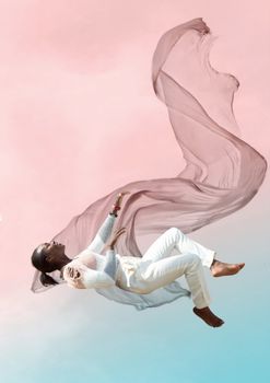 Artistic capture of a woman floating against an ethereal pink backdrop, evoking a sense of freedom and imagination.