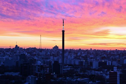 Capturing Montevideo's skyline at sunset with vivid colors and iconic landmarks.