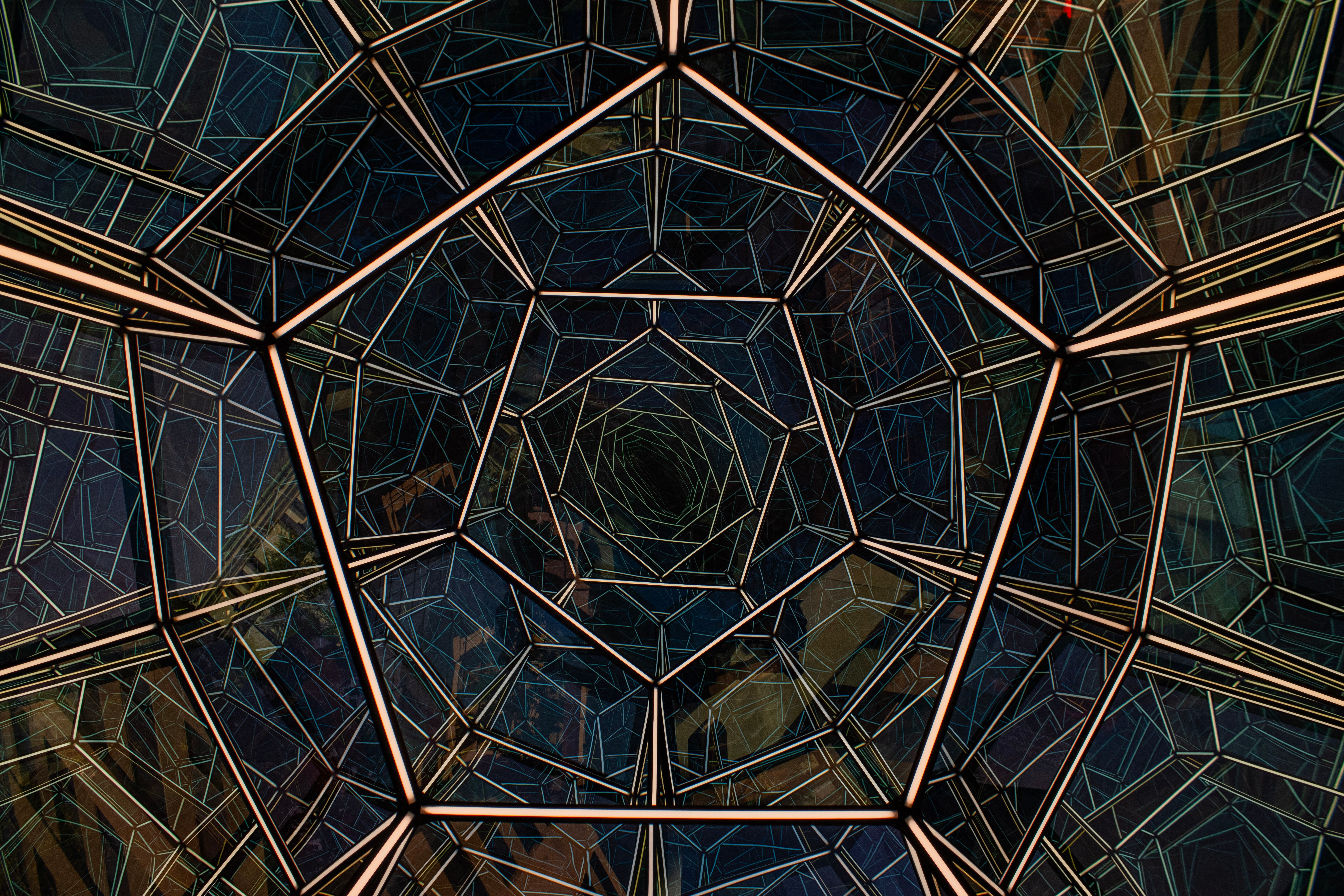Abstract view of an intricate geometric glass roof from below, showcasing modern architectural design in Washington, D.C.