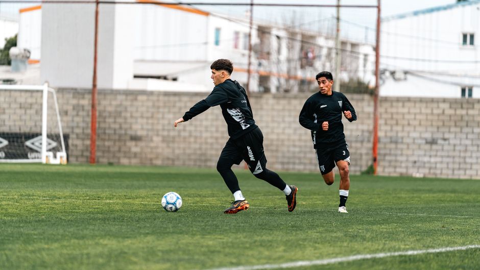 A professional scout analyzing game footage to assist in identifying athletic potential.