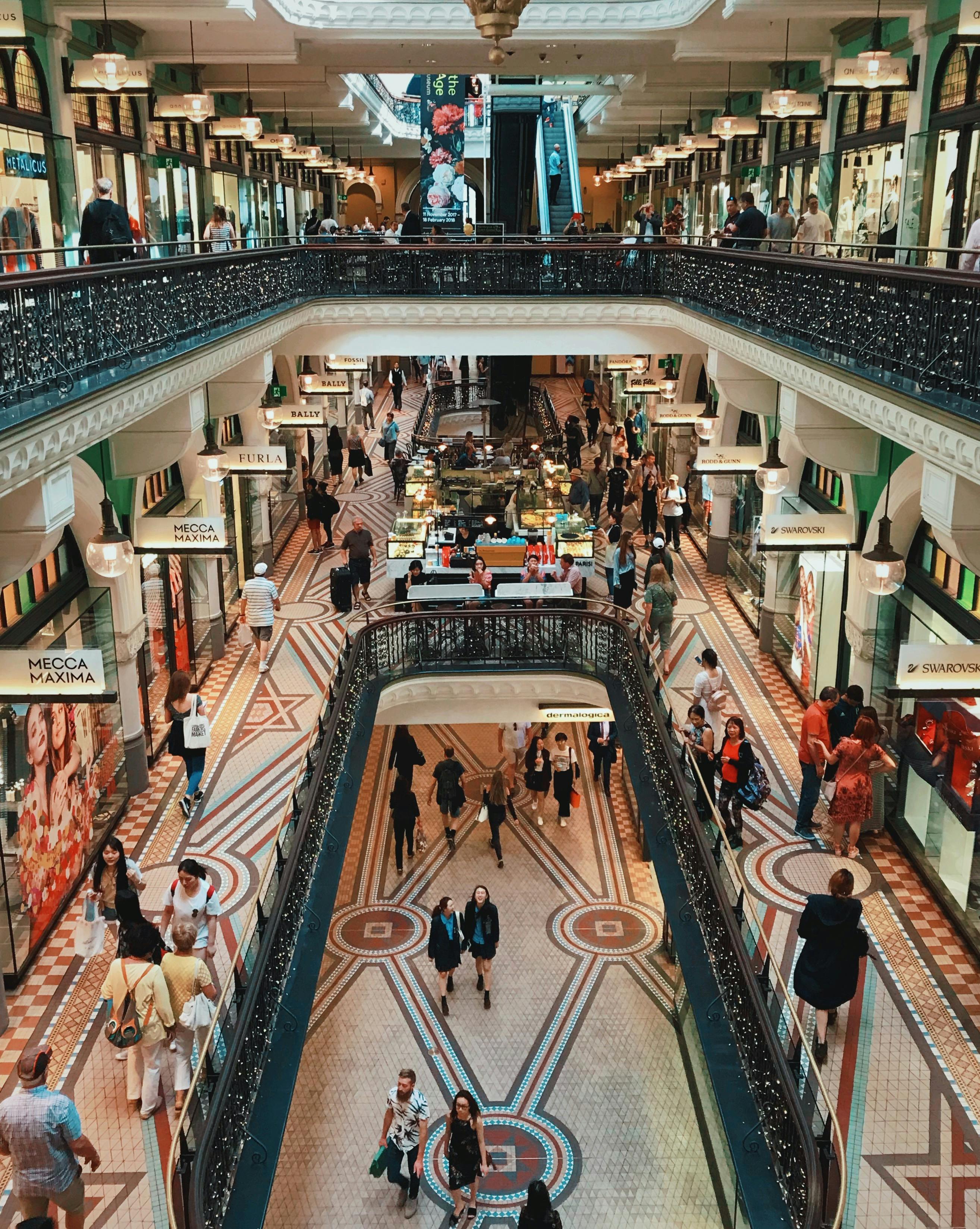 A group of people walking around a mall photo – Free Boston Image