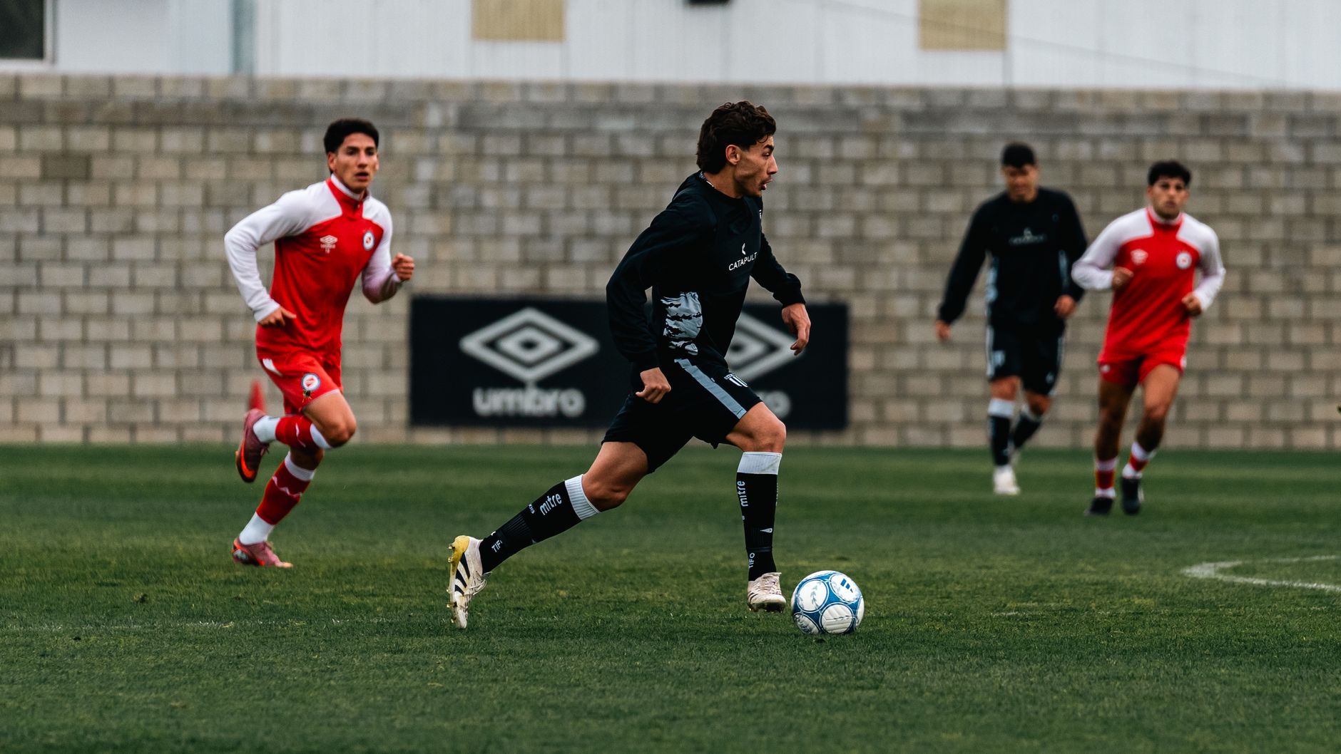 Spain’s young midfield controlling possession on a sunlit training pitch before an international tournament