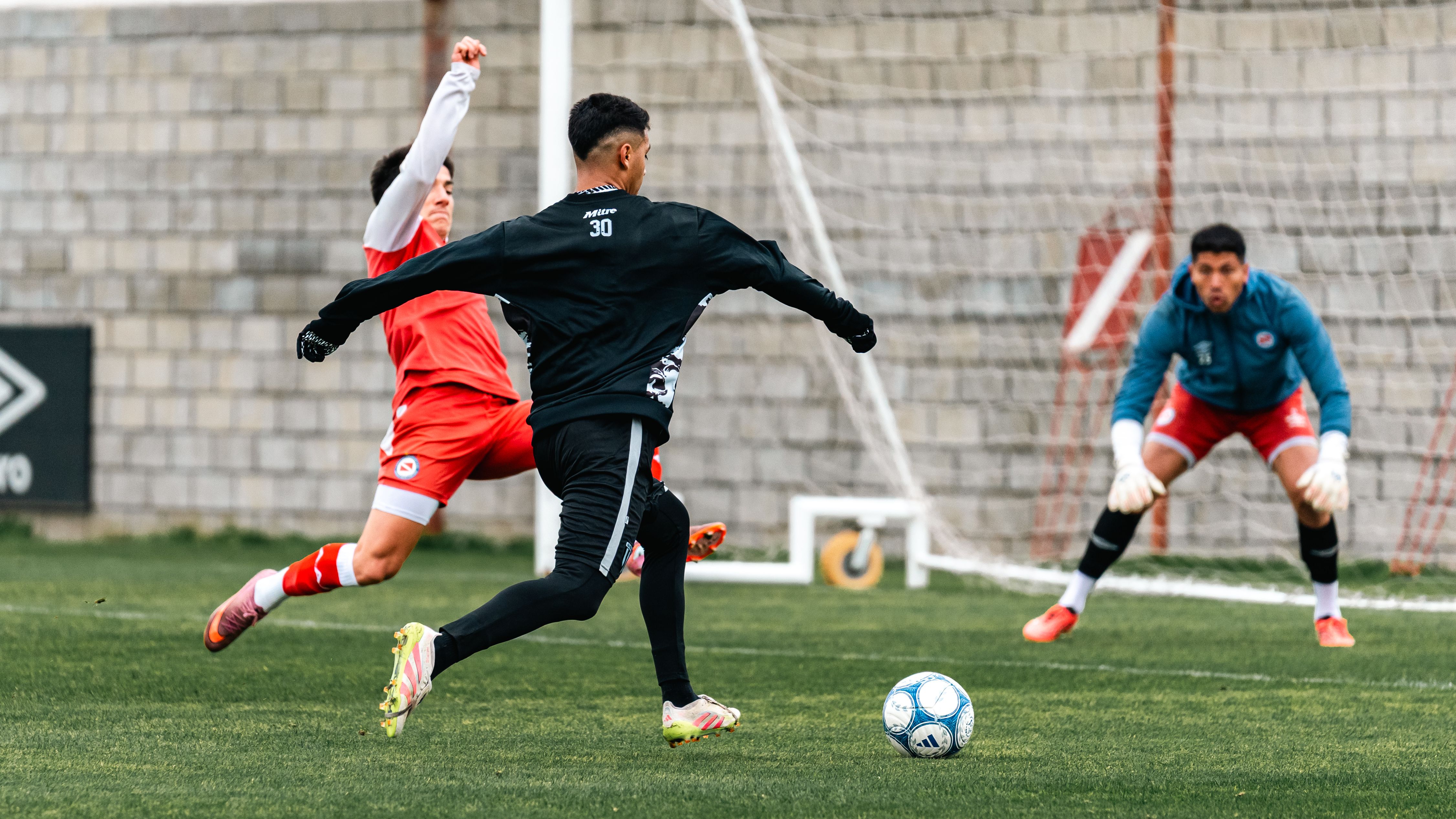 Football players in action during a lively game, focusing on strategy and technique.