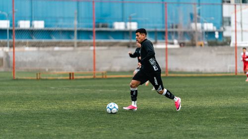 Free Dynamic soccer game with players in motion on the field, showcasing intense sports action. Stock Photo
