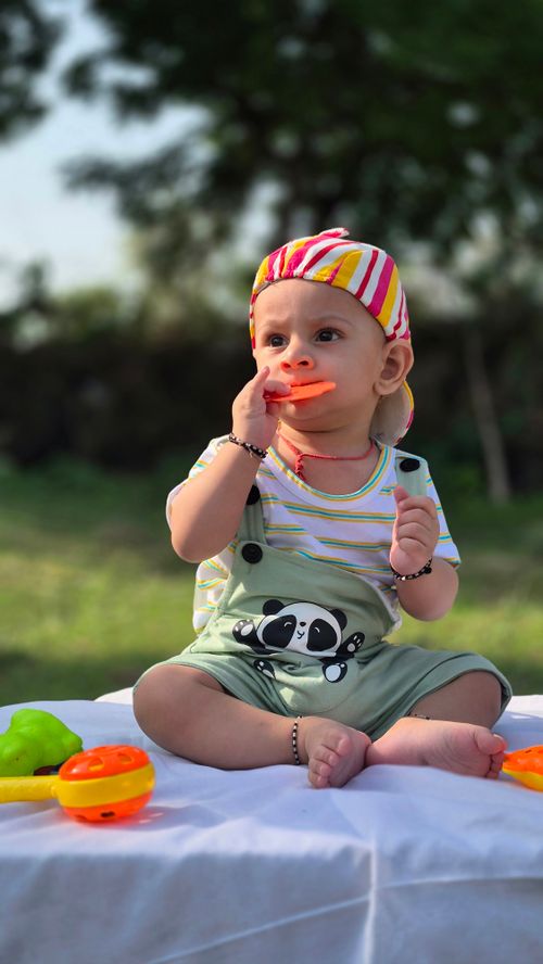 Free Cute baby enjoying playtime outdoors in Rajasthan, India. Stock Photo