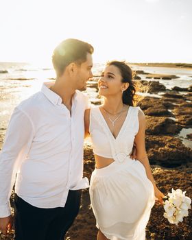 Charming couple celebrating their wedding on a sunny beach in Antalya, Türkiye.