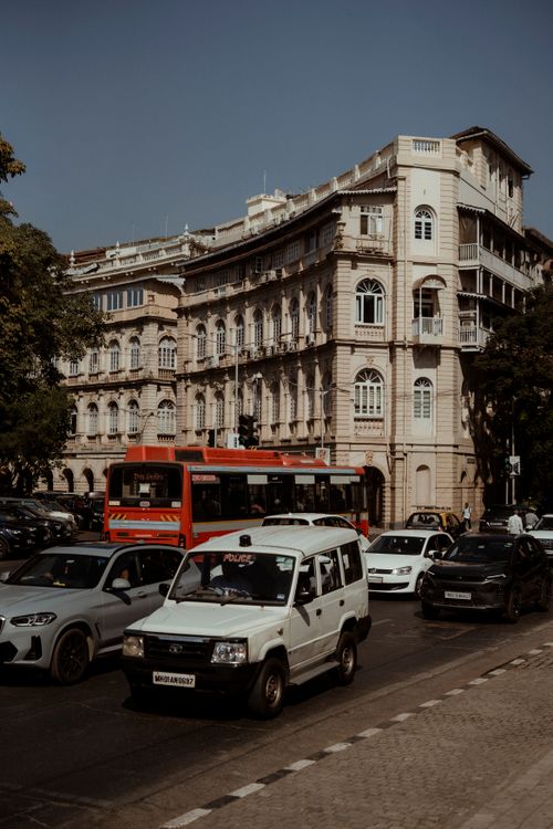 Free A bustling street in Mumbai featuring historic colonial architecture and vibrant city life. Stock Photo