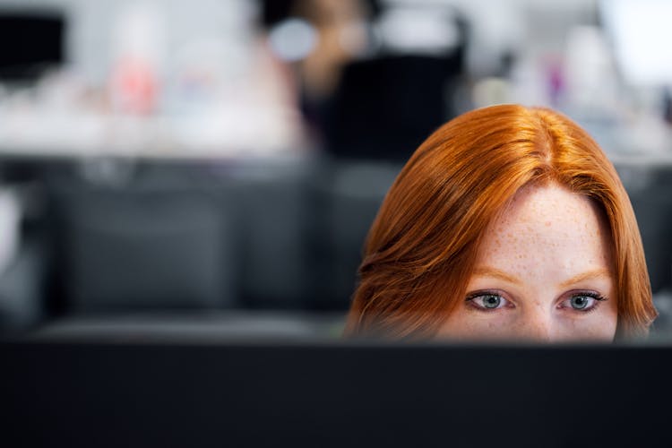 Female Software Engineer Coding On Computer