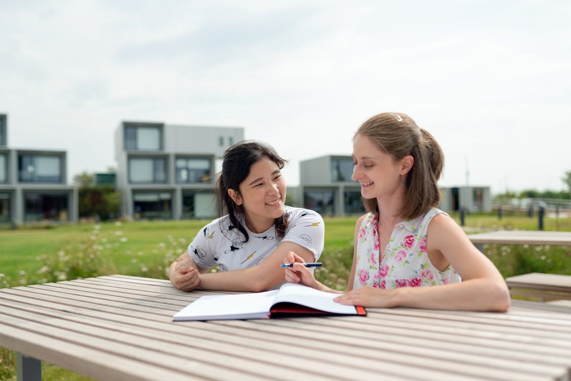 Free Women Sitting Outside Stock Photo