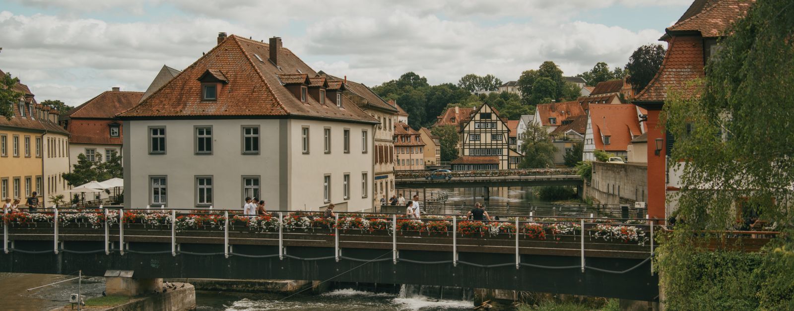 Explore the serene beauty of a German old town with classic architecture and scenic views.