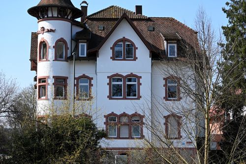 Free Classic villa with unique architecture in Baden-Württemberg, Germany, featuring red accents. Stock Photo