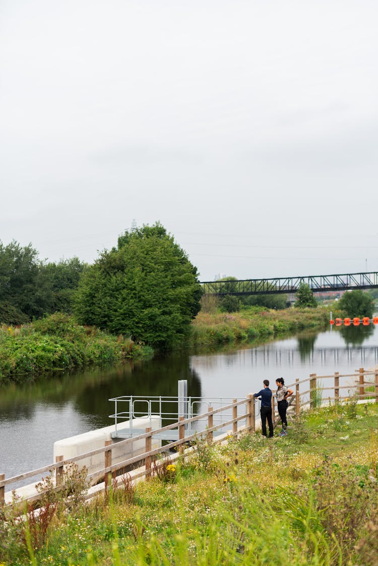 People Standing Near River