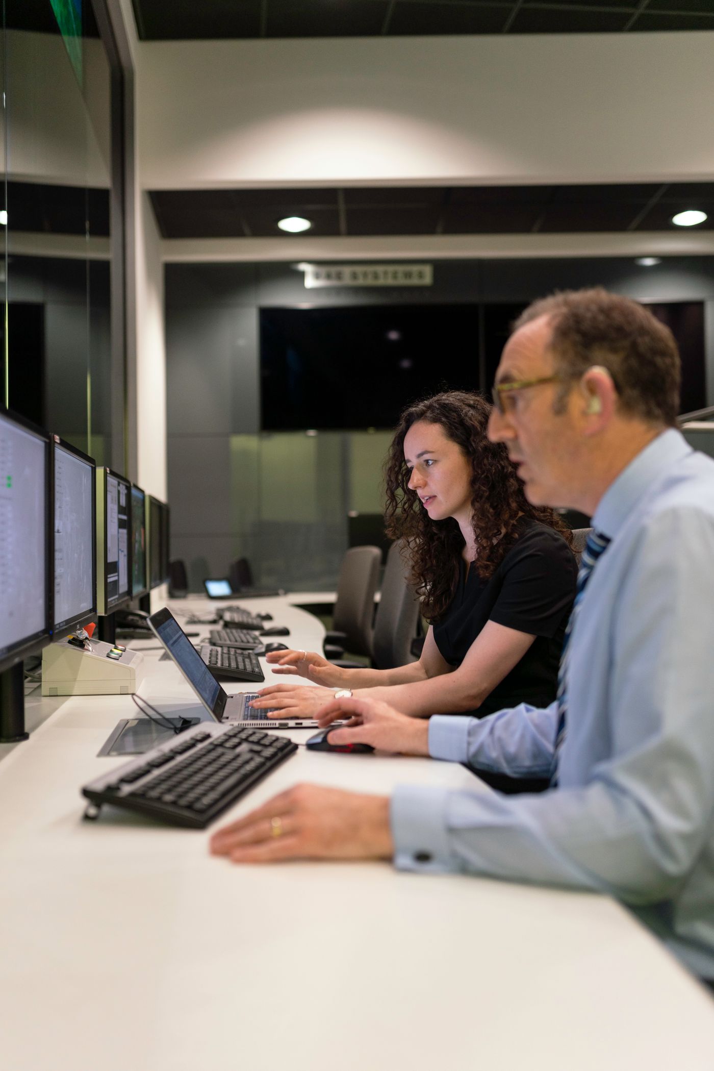 engineers working together in a simulation control room