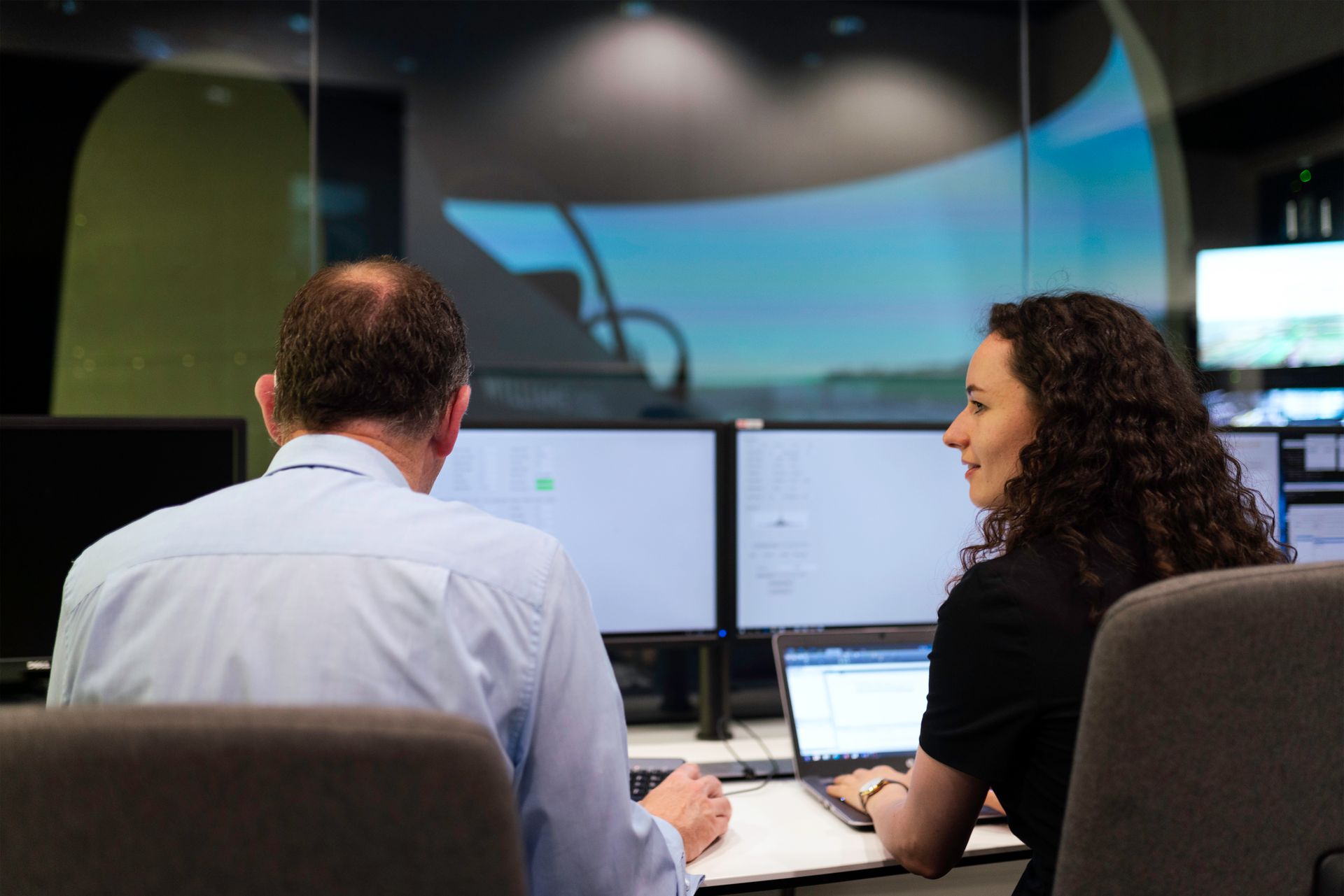 Engineers Controlling Flight Simulator