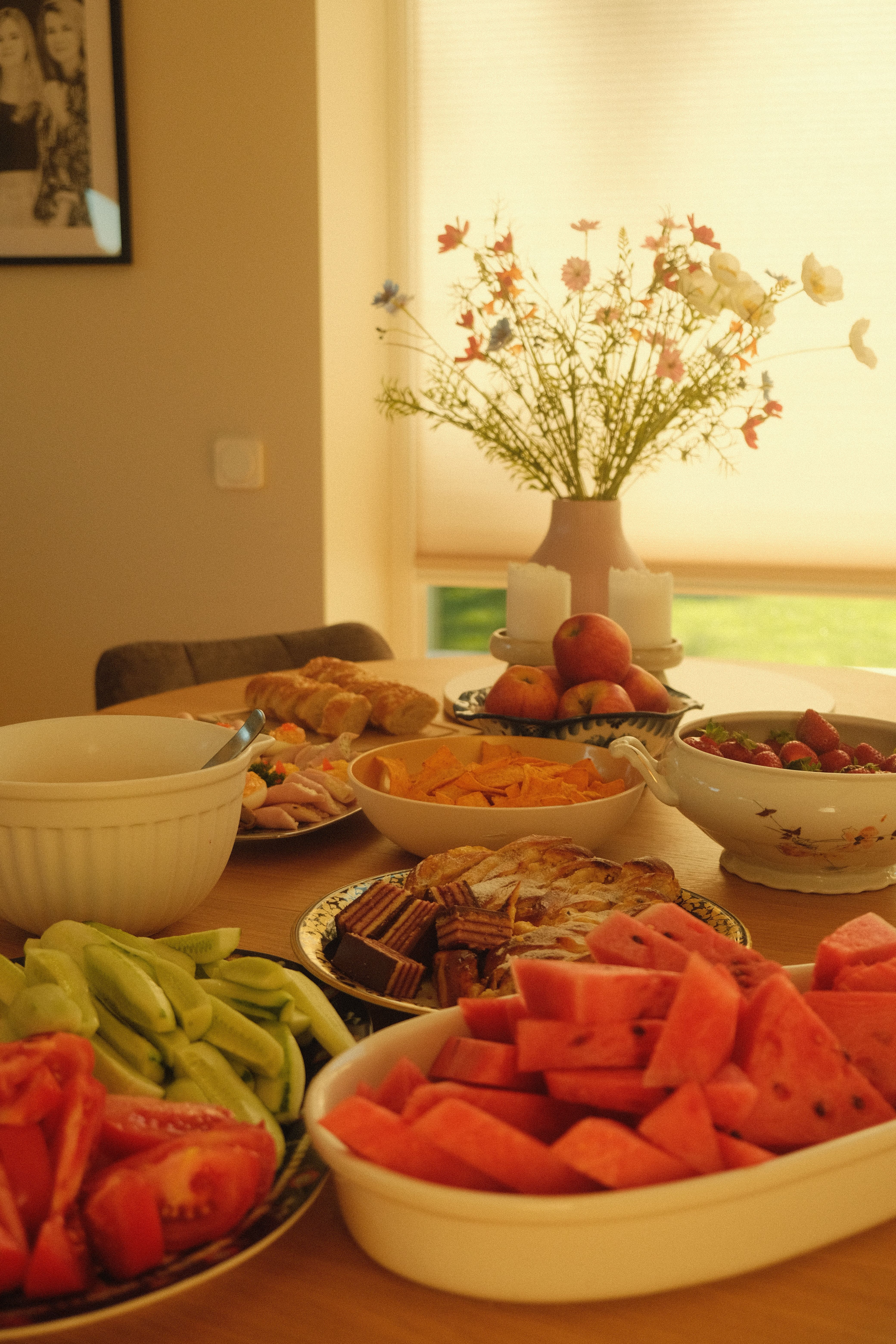A bright and inviting table spread with fresh fruits and vibrant flowers, perfect for a summer brunch.