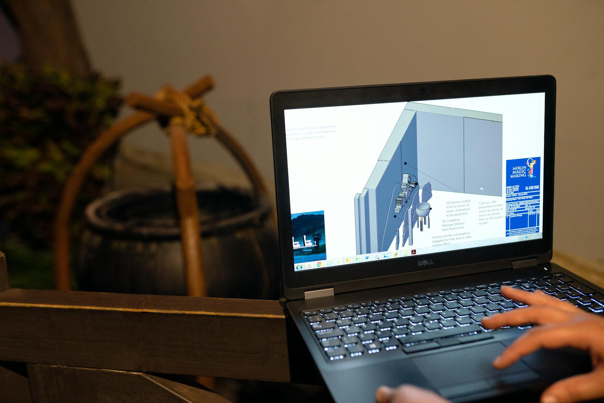 Engineer working on a CAD design using a laptop computer. Indoor setting highlighting technology in engineering.