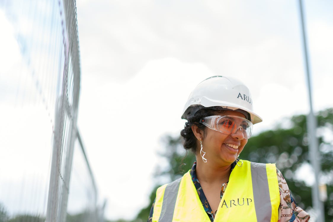 Free Photo Of Female Engineer Wearing Hard Hat And Yellow Vest Stock Photo