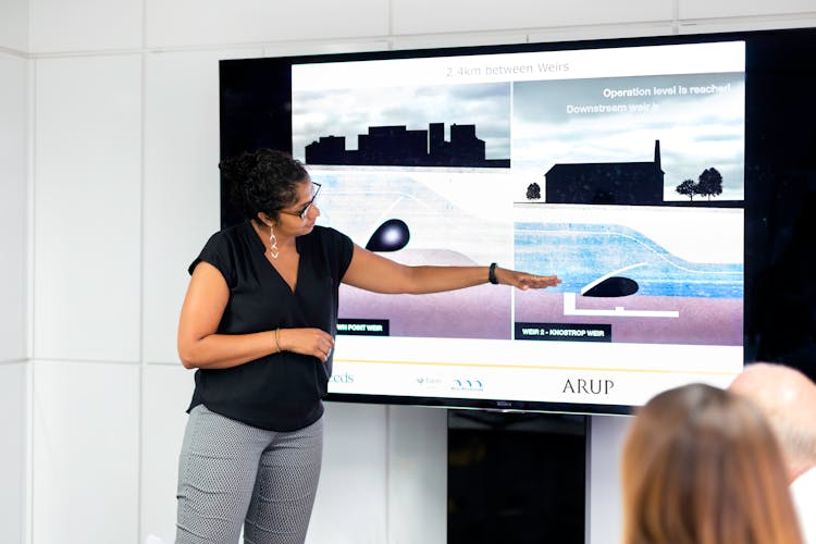 Female Engineer Holding Presentation