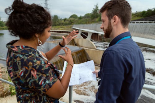 Female Engineer Discussing Plans