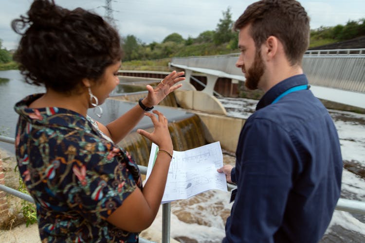 Female Engineer Discussing Plans