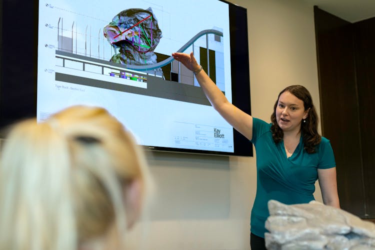 Female Engineer Holding Presentation